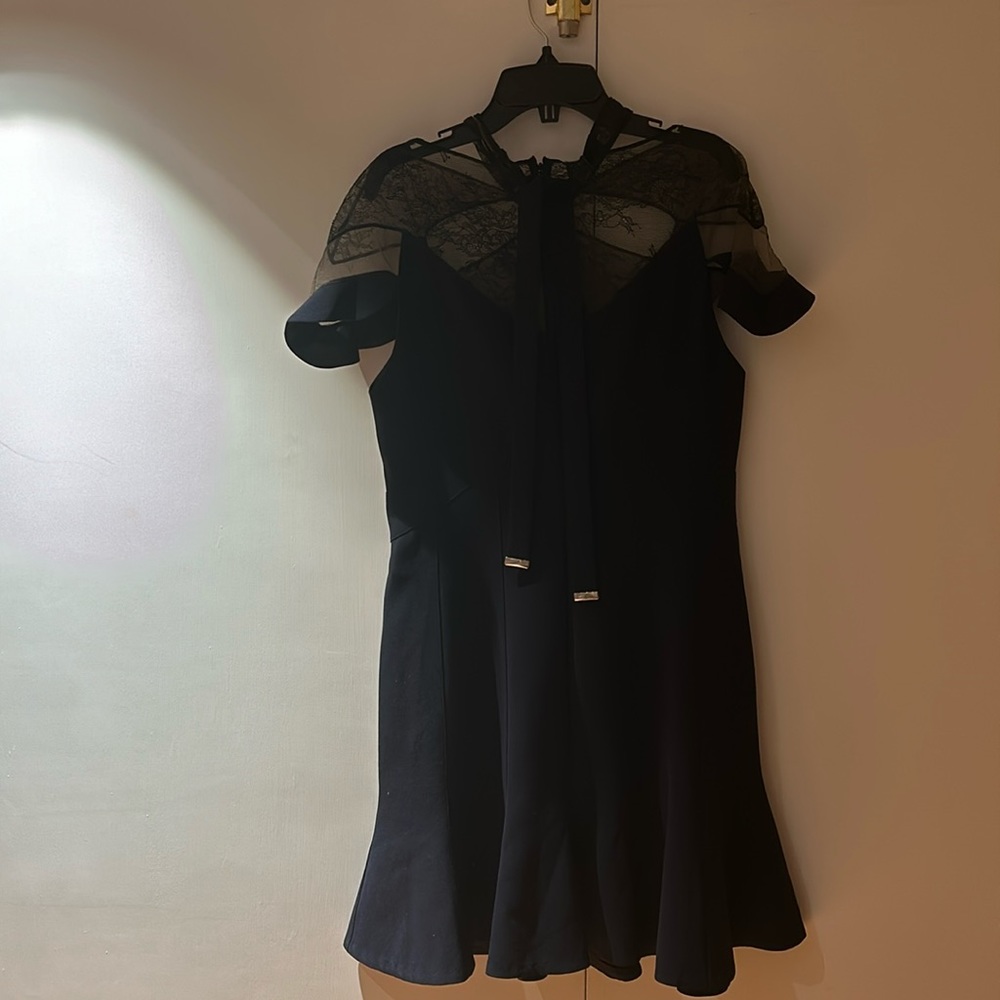 Short sleeve navy mini cocktail dress with open black lace top